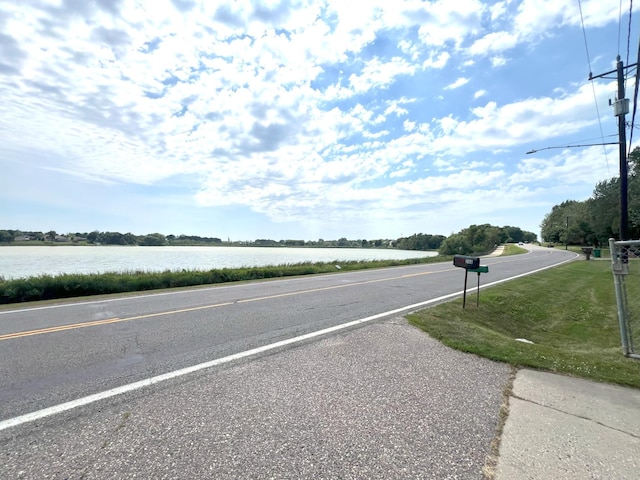 208 Benton St W, Cologne, MN 55322 - view of asphalt road featuring a water view and street lighting