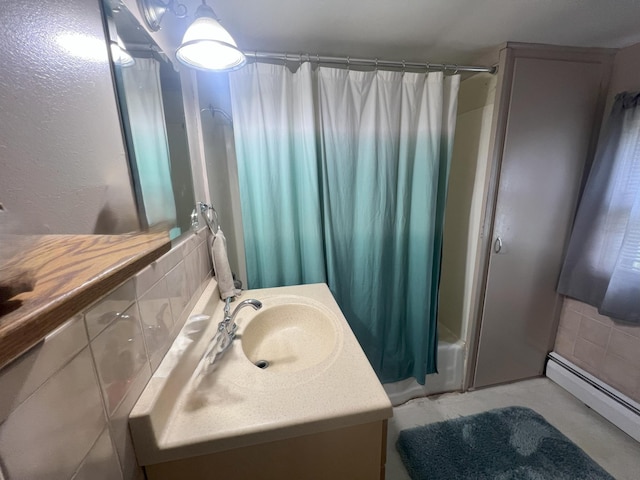 208 Benton St W, Cologne, MN 55322 - bathroom featuring vanity, shower / tub combo with curtain, and a baseboard radiator