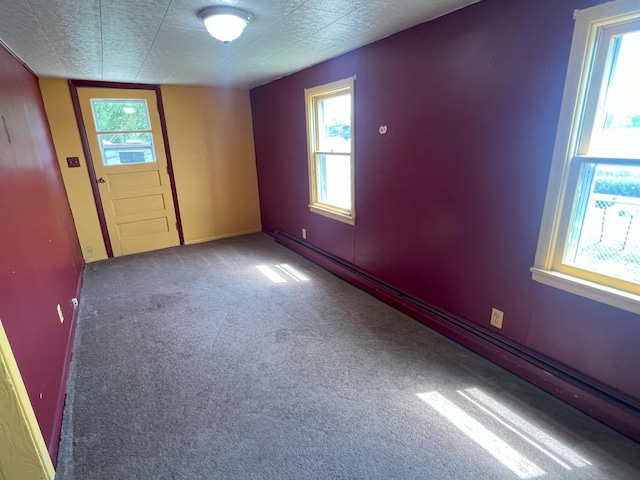 208 Benton St W, Cologne, MN 55322 - carpeted spare room with a baseboard heating unit and baseboards