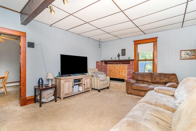 41793 Kilkenny Rd, Kilkenny, MN 56052 - living area featuring light colored carpet, a baseboard heating unit, and a brick fireplace