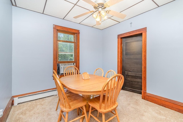 41793 Kilkenny Rd, Kilkenny, MN 56052 - dining room featuring a baseboard heating unit, light carpet, ceiling fan, and cooling unit