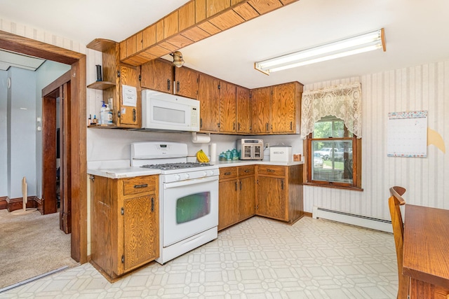 41793 Kilkenny Rd, Kilkenny, MN 56052 - kitchen with white appliances, a baseboard radiator, brown cabinetry, and light countertops