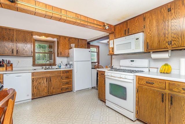 41793 Kilkenny Rd, Kilkenny, MN 56052 - kitchen with white appliances, light countertops, light floors, and brown cabinetry