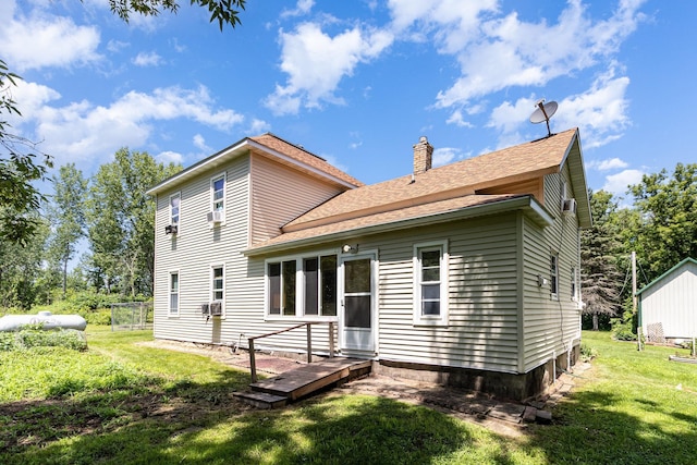 41793 Kilkenny Rd, Kilkenny, MN 56052 - rear view of property featuring a chimney, a lawn, and a shingled roof