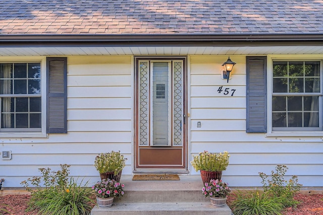 457 108th Ln NW, Coon Rapids, MN 55448 - doorway to property with a shingled roof