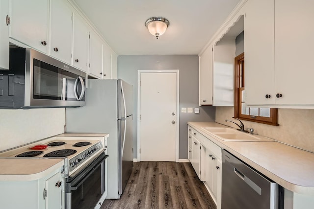 457 108th Ln NW, Coon Rapids, MN 55448 - kitchen featuring appliances with stainless steel finishes, dark wood-style floors, light countertops, and white cabinets