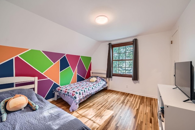 457 108th Ln NW, Coon Rapids, MN 55448 - bedroom featuring wood finished floors and lofted ceiling