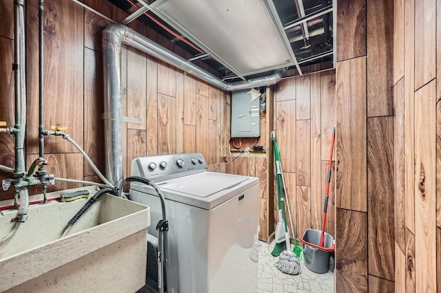 457 108th Ln NW, Coon Rapids, MN 55448 - laundry room with washer / dryer, wood walls, and electric panel