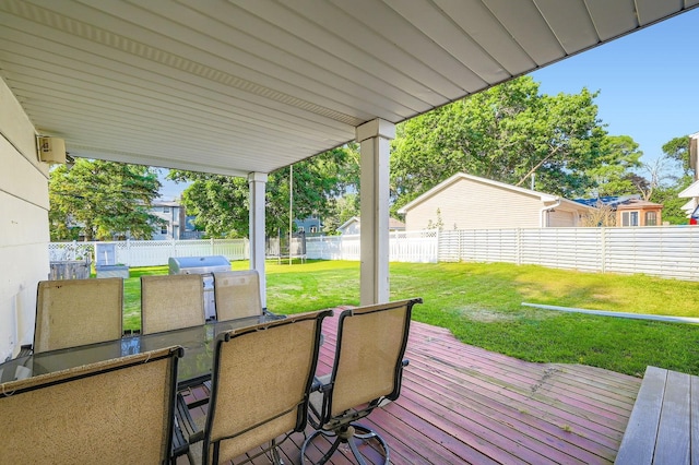 457 108th Ln NW, Coon Rapids, MN 55448 - wooden terrace featuring a fenced backyard, outdoor dining area, and a grill