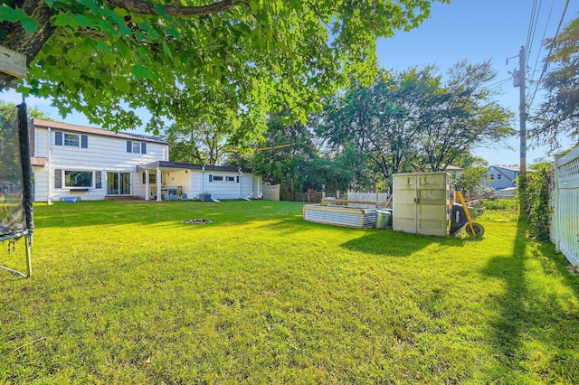 457 108th Ln NW, Coon Rapids, MN 55448 - fenced backyard with a trampoline