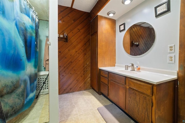 4043 Rehbein Rd, Duluth, MN 55803 - bathroom featuring vanity, wooden walls, and a shower with curtain