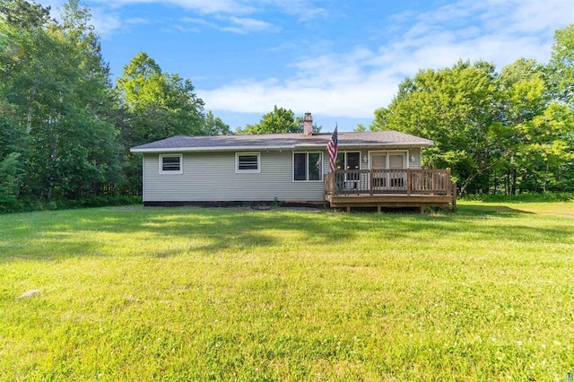 4043 Rehbein Rd, Duluth, MN 55803 - back of house with a wooden deck, a yard, and a chimney