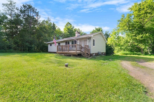 4043 Rehbein Rd, Duluth, MN 55803 - view of front facade with a wooden deck, a front lawn, and a chimney