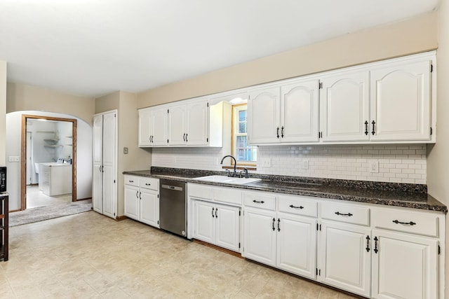 453 Van Dyke St, Saint Paul, MN 55119 - kitchen featuring stainless steel dishwasher, white cabinets, arched walkways, and decorative backsplash