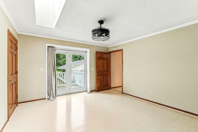453 Van Dyke St, Saint Paul, MN 55119 - spare room featuring a textured ceiling, ornamental molding, light floors, and a skylight
