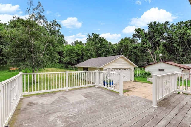 453 Van Dyke St, Saint Paul, MN 55119 - wooden terrace featuring an outdoor structure, a garage, and a yard