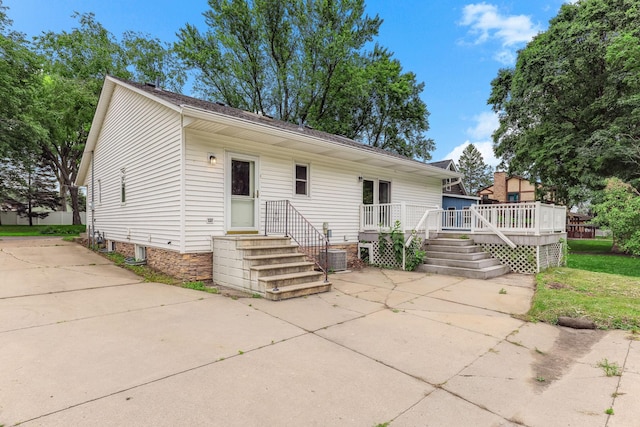 453 Van Dyke St, Saint Paul, MN 55119 - view of front of home featuring a deck, a patio, and concrete driveway