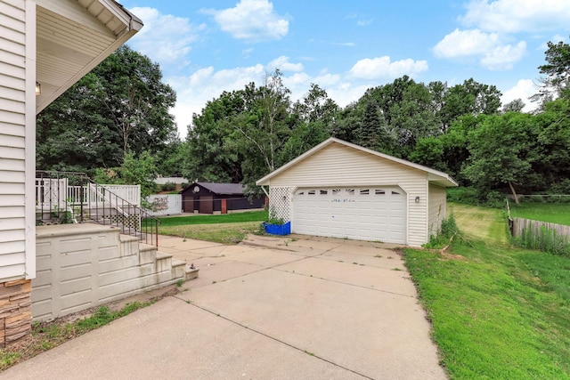 453 Van Dyke St, Saint Paul, MN 55119 - detached garage featuring view of scattered trees