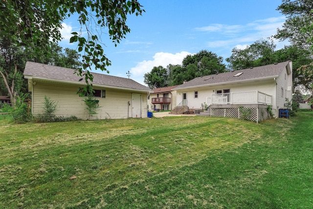 453 Van Dyke St, Saint Paul, MN 55119 - rear view of house with a wooden deck and a lawn