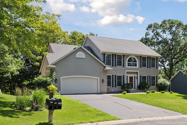4116 River Run, Savage, MN 55378 - colonial-style house with driveway, an attached garage, a front yard, and roof with shingles