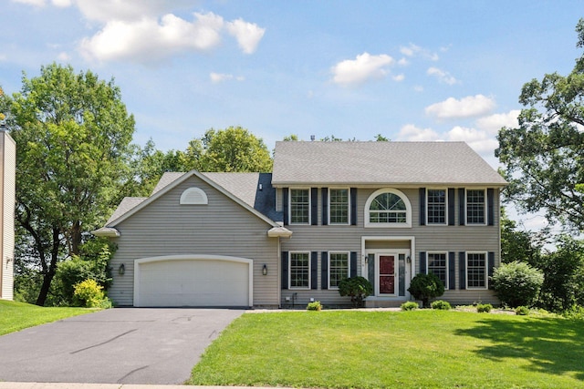 4116 River Run, Savage, MN 55378 - colonial home with asphalt driveway, an attached garage, and a front yard
