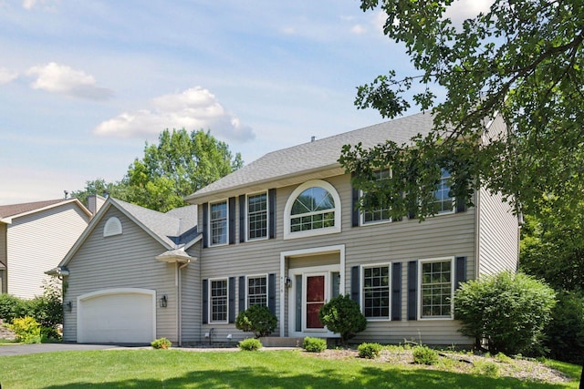 4116 River Run, Savage, MN 55378 - colonial inspired home with a garage, a front lawn, asphalt driveway, and a shingled roof