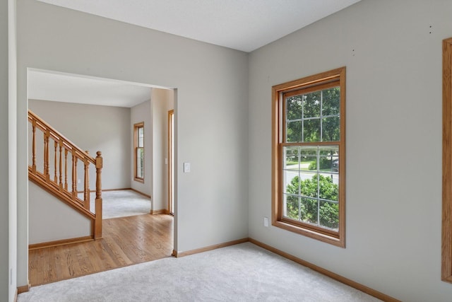4116 River Run, Savage, MN 55378 - carpeted empty room featuring baseboards and stairs