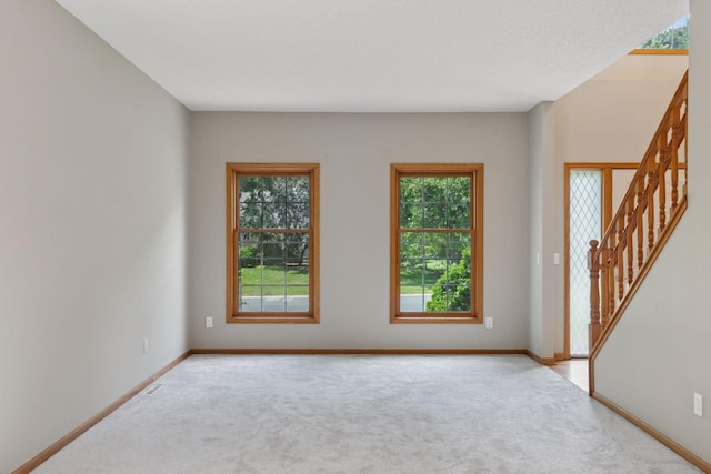 4116 River Run, Savage, MN 55378 - carpeted spare room featuring stairway and baseboards