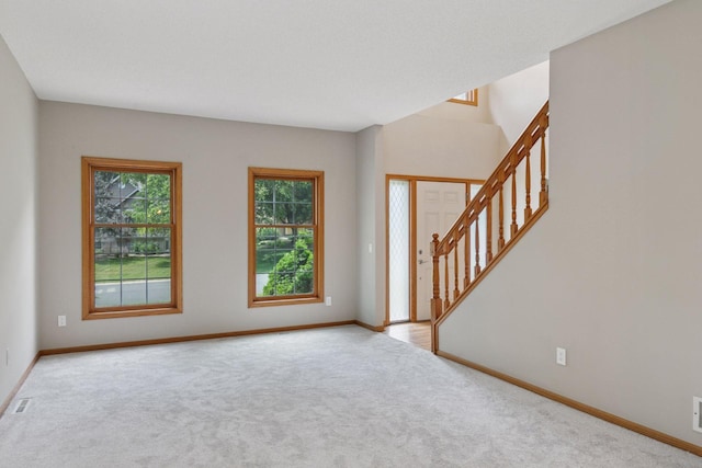 4116 River Run, Savage, MN 55378 - carpeted foyer entrance featuring stairway and baseboards
