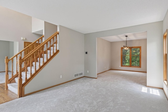 4116 River Run, Savage, MN 55378 - unfurnished living room with stairway and carpet floors