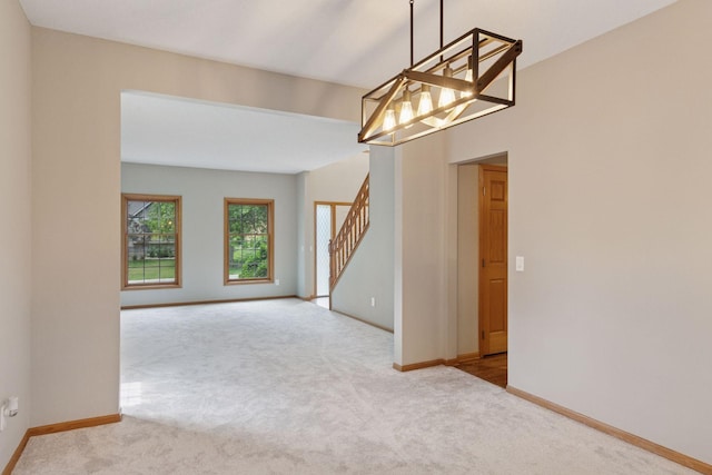 4116 River Run, Savage, MN 55378 - unfurnished room featuring carpet floors, stairs, and a chandelier