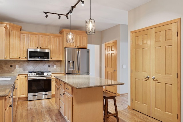 4116 River Run, Savage, MN 55378 - kitchen with appliances with stainless steel finishes, light brown cabinets, and light wood-style floors