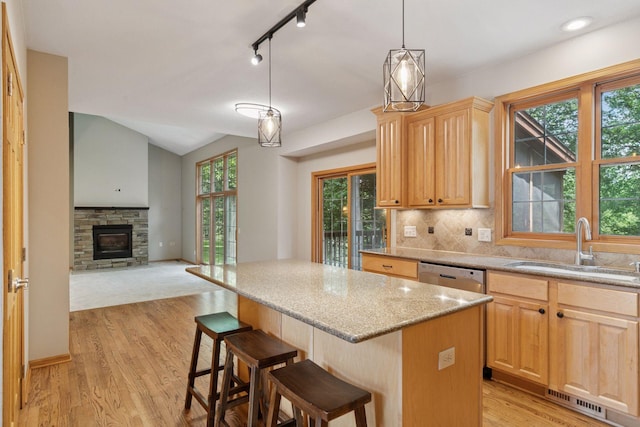 4116 River Run, Savage, MN 55378 - kitchen featuring light brown cabinetry, dishwasher, light wood finished floors, a center island, and plenty of natural light