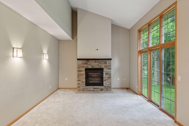 4116 River Run, Savage, MN 55378 - unfurnished living room featuring carpet flooring, a stone fireplace, and high vaulted ceiling