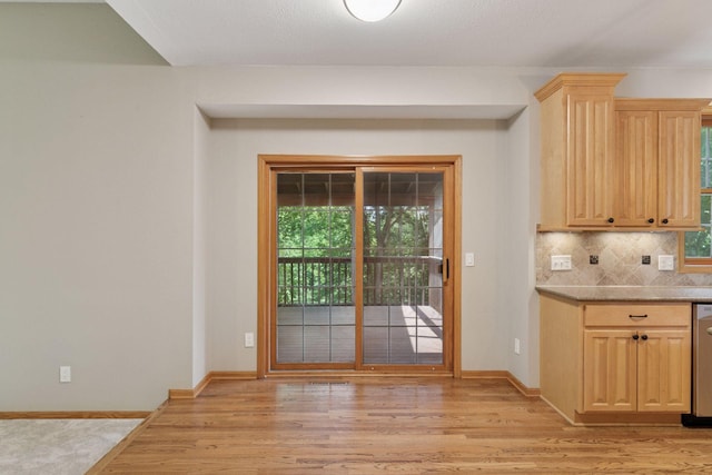 4116 River Run, Savage, MN 55378 - kitchen with light brown cabinets, light wood-type flooring, tasteful backsplash, and stainless steel dishwasher