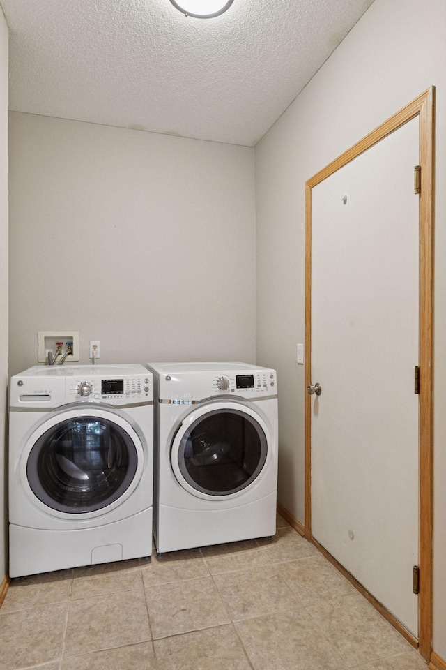 4116 River Run, Savage, MN 55378 - washroom with independent washer and dryer, a textured ceiling, and light tile patterned floors