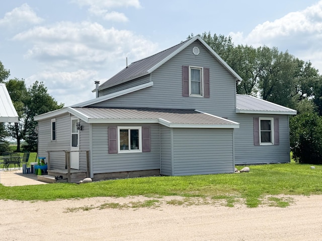 35448 200th St, Brewster, MN 56119 - view of side of home featuring a metal roof and a lawn