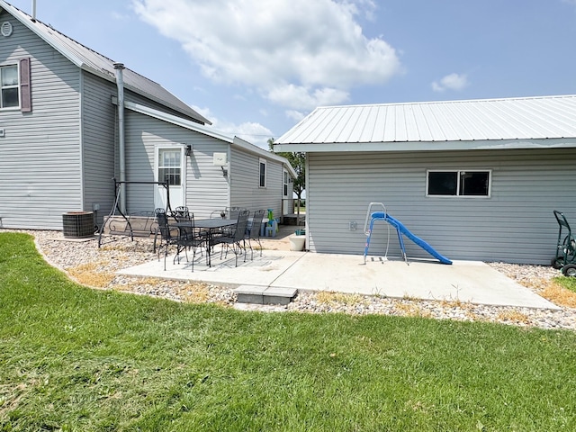 35448 200th St, Brewster, MN 56119 - rear view of property featuring a lawn, a patio, and a metal roof