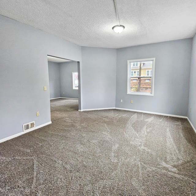 3253 Humboldt Ave N, Minneapolis, MN 55412 - carpeted empty room with baseboards and a textured ceiling