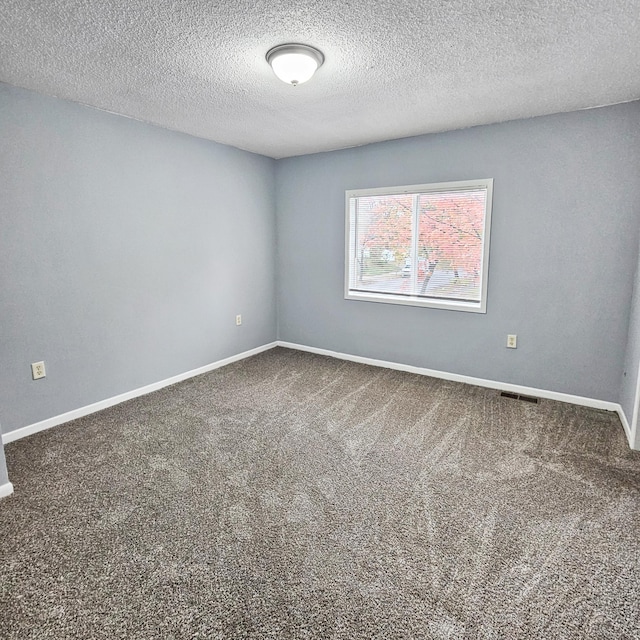 3253 Humboldt Ave N, Minneapolis, MN 55412 - carpeted empty room with a textured ceiling and baseboards