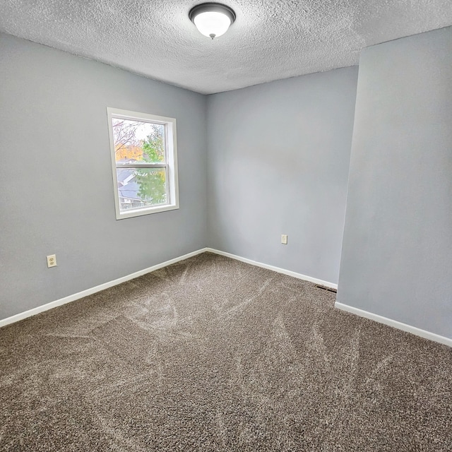 3253 Humboldt Ave N, Minneapolis, MN 55412 - carpeted empty room featuring a textured ceiling and baseboards