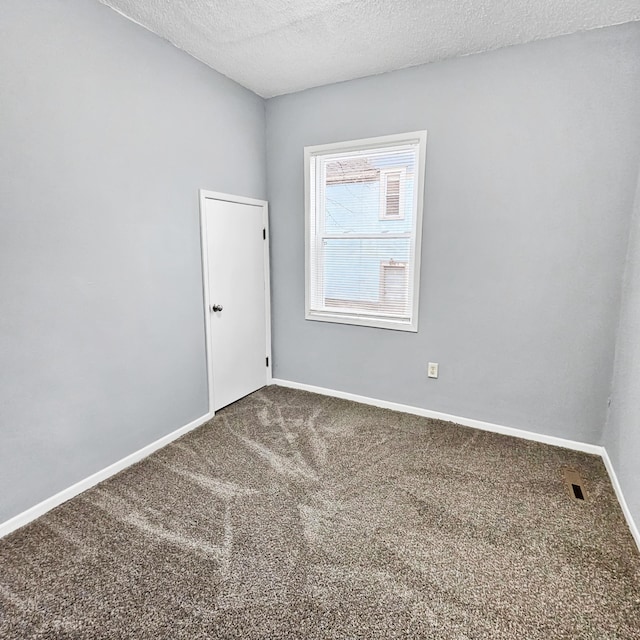 3253 Humboldt Ave N, Minneapolis, MN 55412 - empty room featuring carpet flooring and a textured ceiling