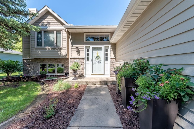 2045 Roberta Dr, North Mankato, MN 56003 - property entrance featuring stone siding and a chimney