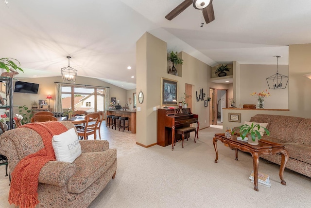 2045 Roberta Dr, North Mankato, MN 56003 - living area featuring lofted ceiling, light colored carpet, a ceiling fan, and a chandelier