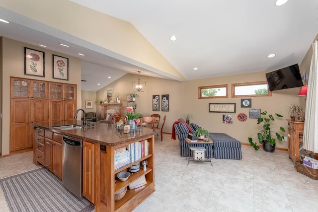2045 Roberta Dr, North Mankato, MN 56003 - kitchen with stainless steel dishwasher, vaulted ceiling, recessed lighting, brown cabinetry, and an island with sink