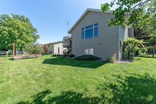 2045 Roberta Dr, North Mankato, MN 56003 - rear view of house with a lawn