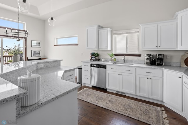 1592 69th Ave S, Fargo, ND 58104 - kitchen featuring dishwasher, a chandelier, white cabinets, light stone counters, and hanging light fixtures