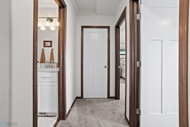 1592 69th Ave S, Fargo, ND 58104 - hallway featuring carpet flooring and a sink