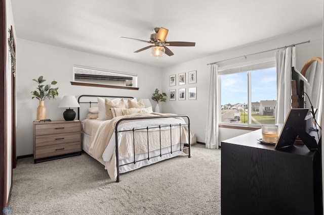 1592 69th Ave S, Fargo, ND 58104 - bedroom with light colored carpet and a ceiling fan