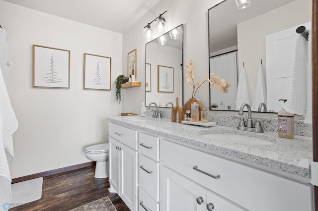 1592 69th Ave S, Fargo, ND 58104 - bathroom featuring double vanity and wood finished floors
